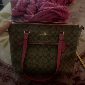 Coach Brown Signature Tote with Pink Trim and Handles goes for way more